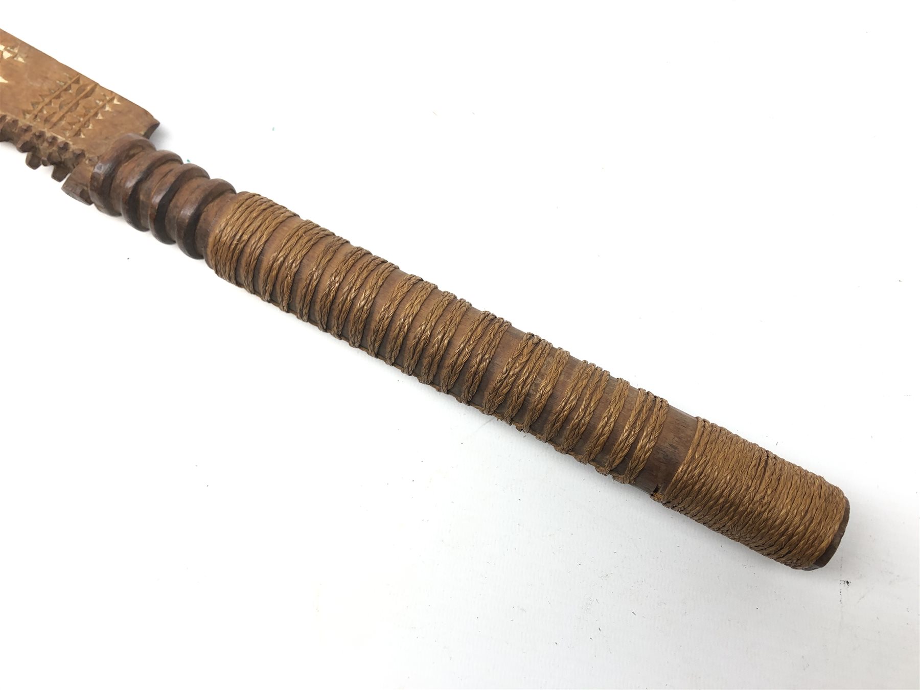 Samoan wooden club, shaped blade with serrated edge and painted