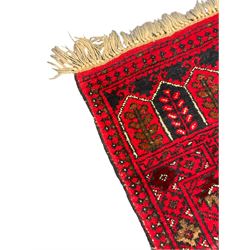 Persian red and blue ground prayer rug, decorated with stylised plant motifs (106cm x 70cm); Persian red ground rug, the field decorated with geometric medallions surrounded by small stylised motifs (98cm x 61cm