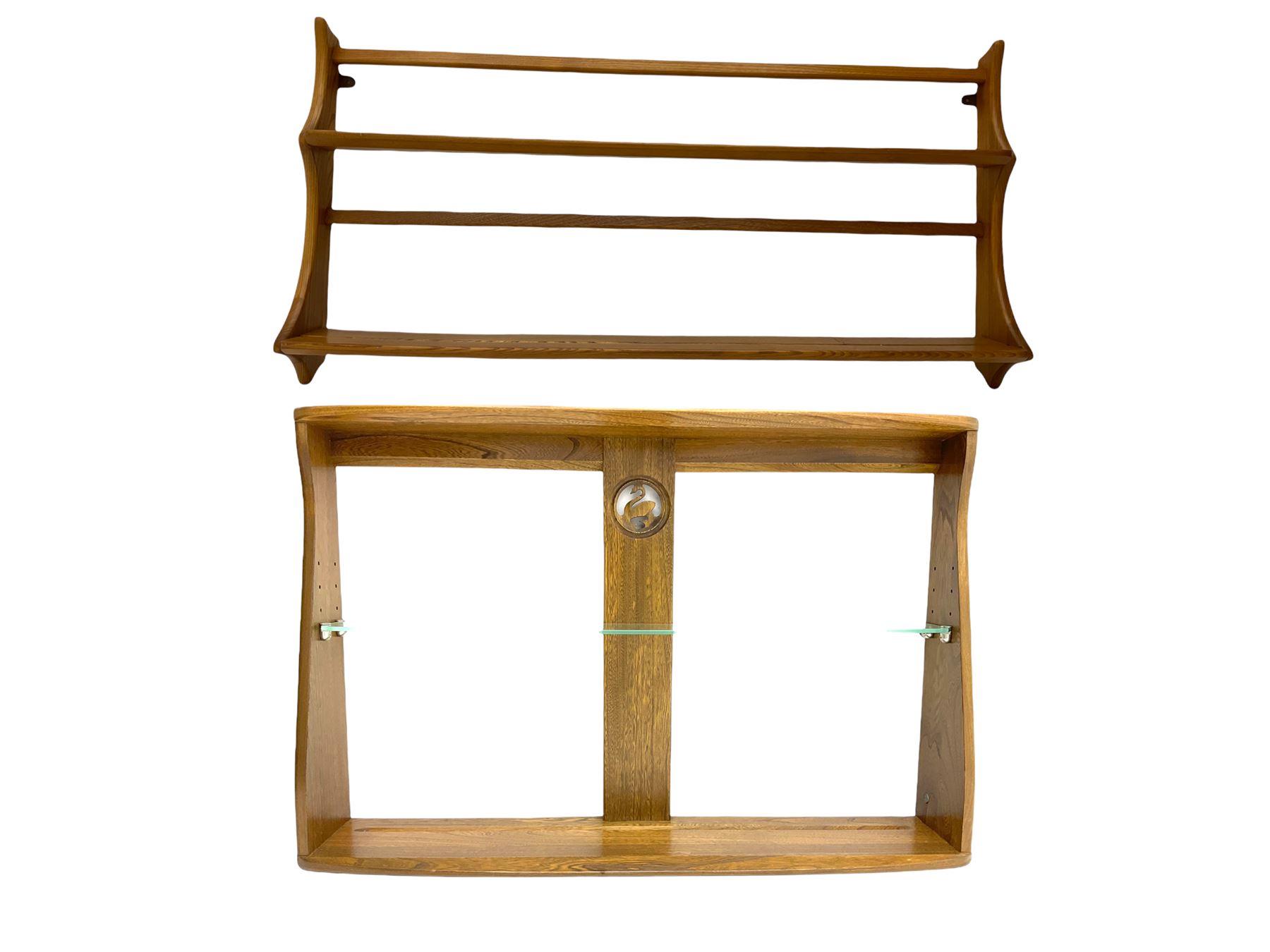 Ercol medium elm two tier wall plate rack, and additional Ercol two tier wall plate rack, with glass shelf and swan detail. 