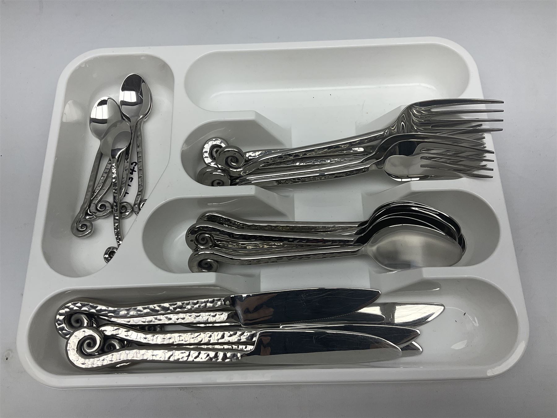 Artisan 24 piece stainless steel cutlery set in the Hammered Shell pattern