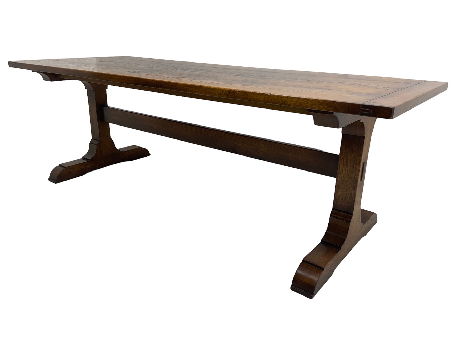 Dorset Oak - large refectory dining table, rectangular plank top, raised on shaped end supports with sledge feet, united by stretcher