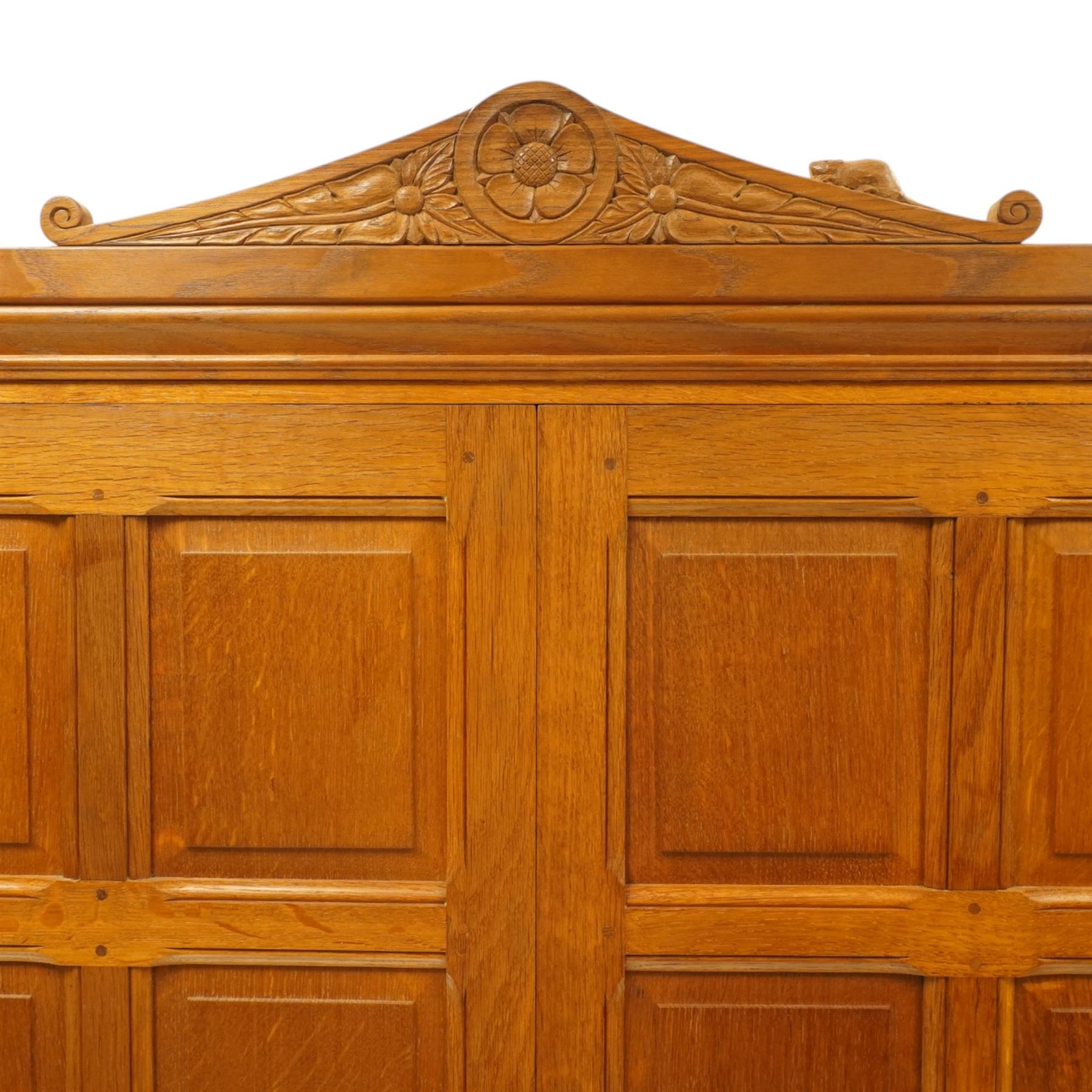 Beaverman - Yorkshire oak panelled double wardrobe, with carved pediment, panelled doors and sides, with internal top shelf above a single hanging rail, with carved beaver signature, by Colin Almack of Sutton near Thirsk