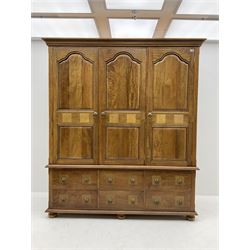 Barker and Stonehouse mango wood and flagstone triple wardrobe, three doors above four drawers and single cupboard
