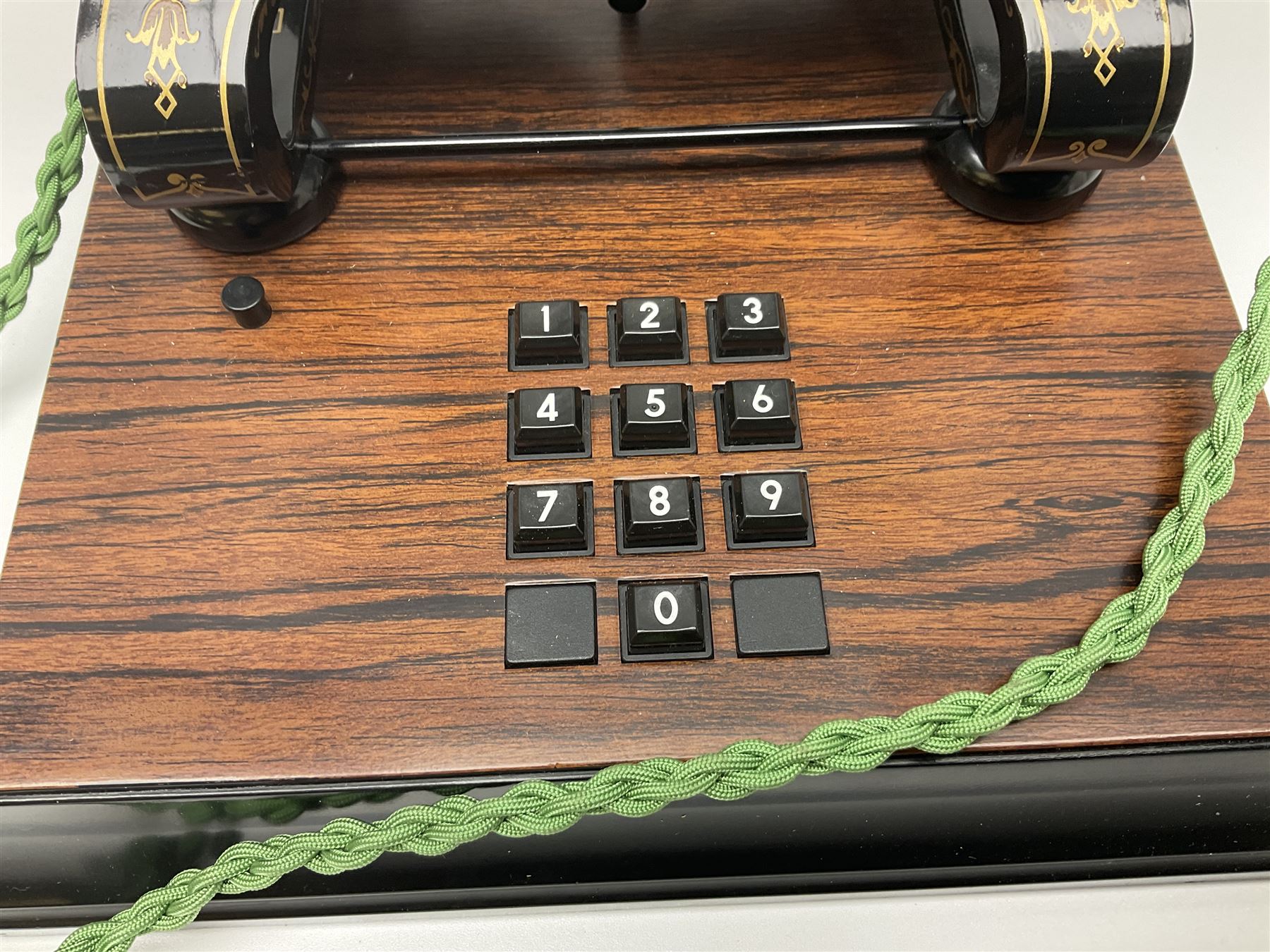 LM Ericsson of Sweden reproduction skeletal telephone, commemorating the centenary of the first 'Tax' in 1892, with gilded details on square walnut base with keypad and brass plaque beneath numbered 1892-09305, H35cm