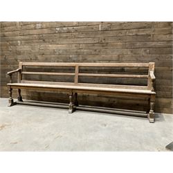 Victorian pitch pine bench pew, turned arms and legs, rail back with plank seat, 274cm