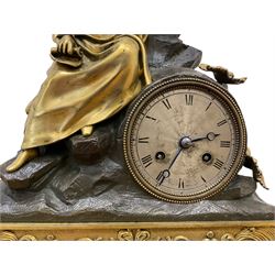 French-Louis XVIII  8-day mantle clock c1820, on a rectangular gilt metal base incorporating repeating cast leaf decoration on a pierced apron and bracket feet, surmounted with a cast brass figure depicting a reclining lady in 18th century dress, Parisian drum movement with a silk suspension and unglazed silvered dial, with Roman numerals and steel moon hands, dial pinned to a countwheel striking movement, sounding the hours and half-hours on a bell. With pendulum and key.
