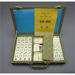  Chinese mah jongg set with bone and bamboo tiles and sticks in decorative cloth covered wooden carrying case with bone toggles and instruction booklet  