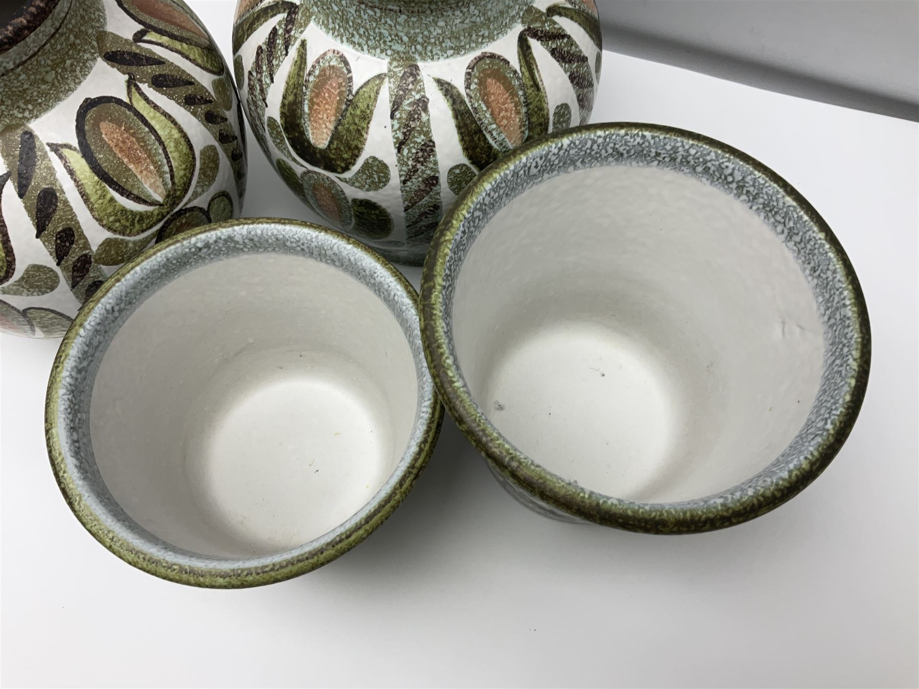 Pair of Denby Glyn Colledge stoneware vases of baluster form with floral decoration over cream ground, together two jardiniere in a similar design, vases H24cm