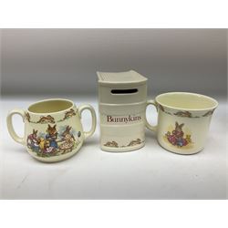 Royal Doulton Bunnykins ceramics, comprising two baby bowls, twin handled cup, two plates, money box, cup, bowl and spoon (9)