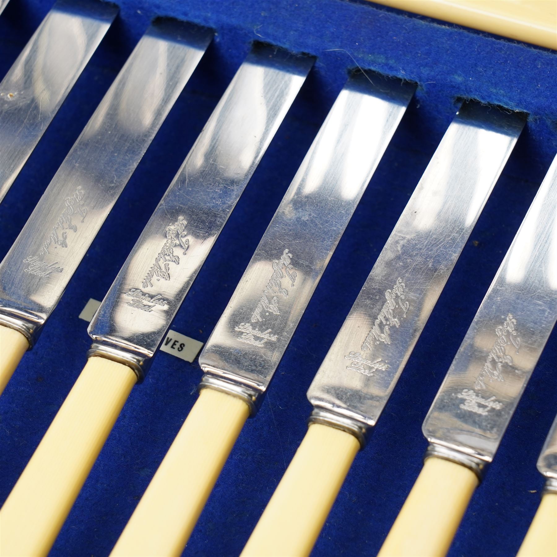 Suite of plated table cutlery for twelve covers including fish cutlery and servers, fruit knives and forks with mother of pearl handles, bone handled knives, carvers etc in an oak  three drawer cabinet with hinged lid W47cm 160 pieces