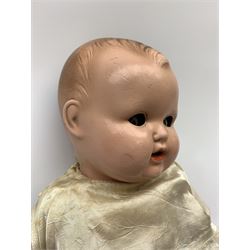 Seyfarth & Reinhardt composition head baby doll with moulded hair, sleeping flirty eyes, open mouth with one tooth and tongue and soft body with composition jointed limbs, marked 'SuR Germany 30/5' H47cm; together with a Golborne Dolls 'Golborne Beauty' composition head and body bride doll, marked 'F.P.23' in original box H63cm (2)