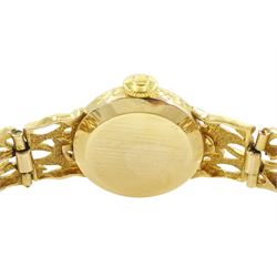 Omega ladies 9ct gold manual wind wristwatch, Ref. 7115674, silvered dial with baton hour markers, on 9ct gold pierced design bracelet, London 1972, with guarantee dated 1973