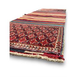 Southwest Persian Qashqai saddle bag, red and ivory ground with diamond-shaped star motifs in the top and bottom panels, central field decorated with alternating horizontal stripes