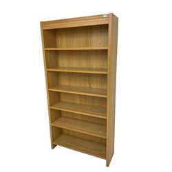 Oak open bookcase fitted with five adjustable shelves