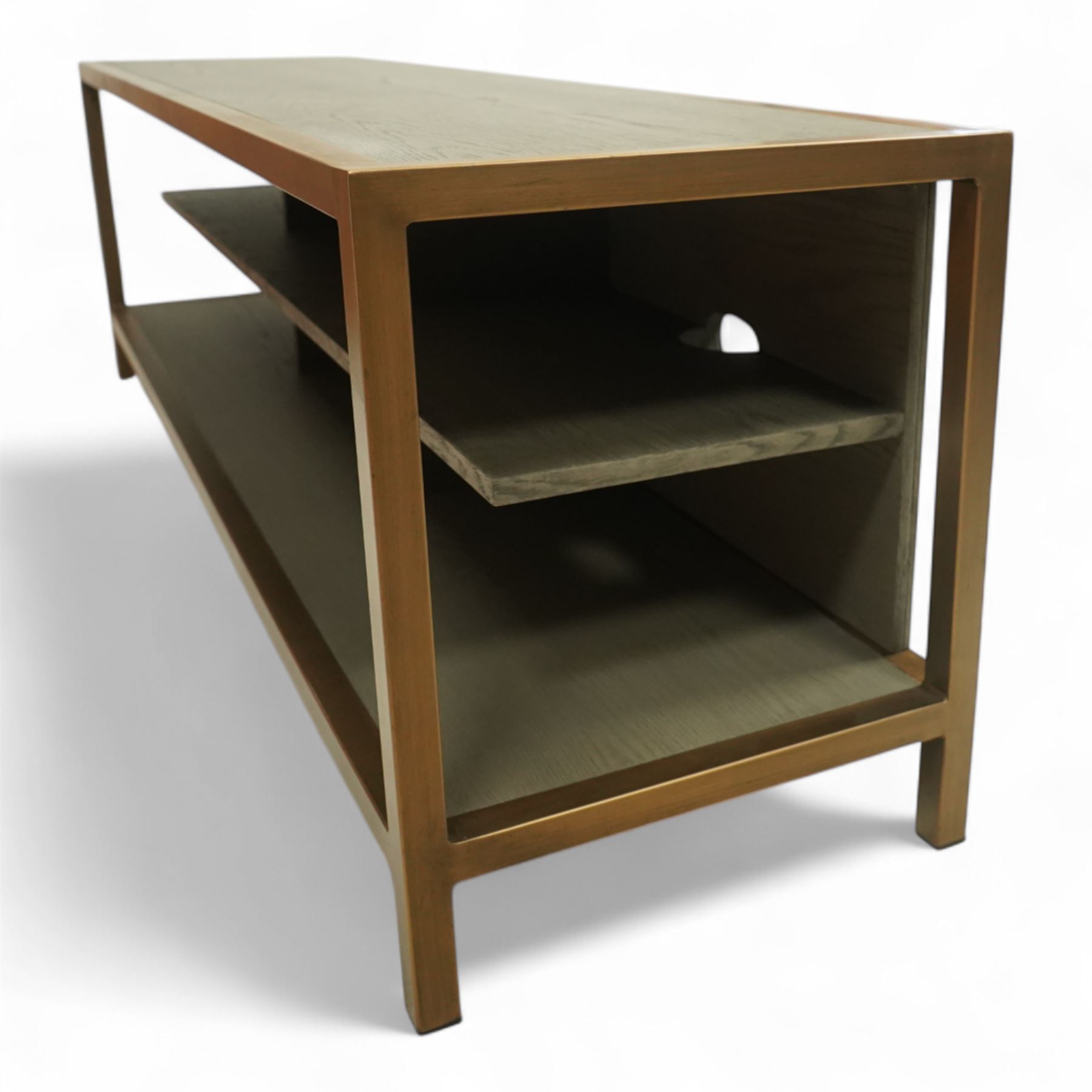 Contemporary low television stand, brass-effect metal frame enclosing six open oak veneered compartments, raised on square tubular supports
