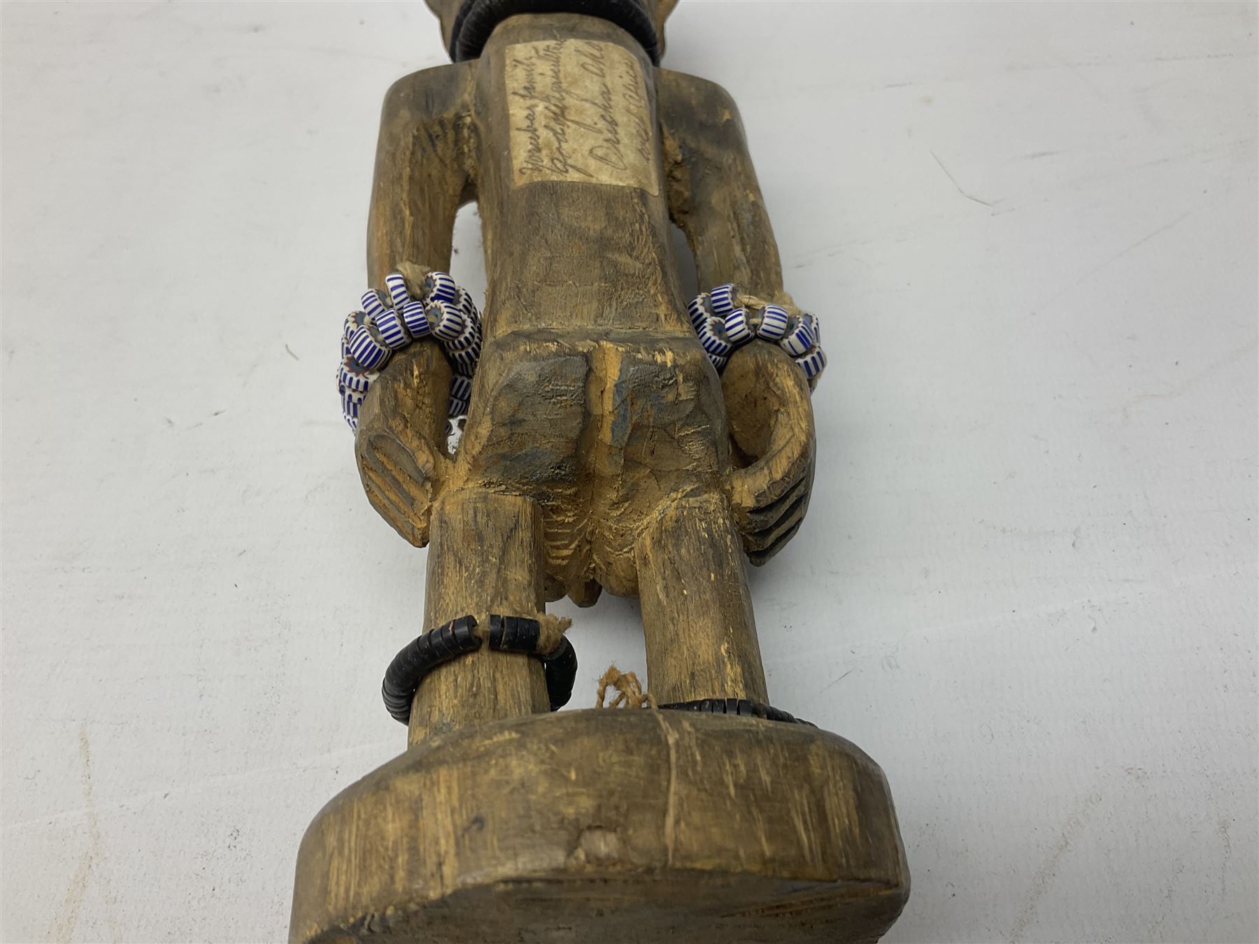 Early 20th century West African Yoruba family wooden figure of Orisha Oko, the god of farming/agriculture, carved from the solid, bears manuscript label of provenance verso H26.5cm