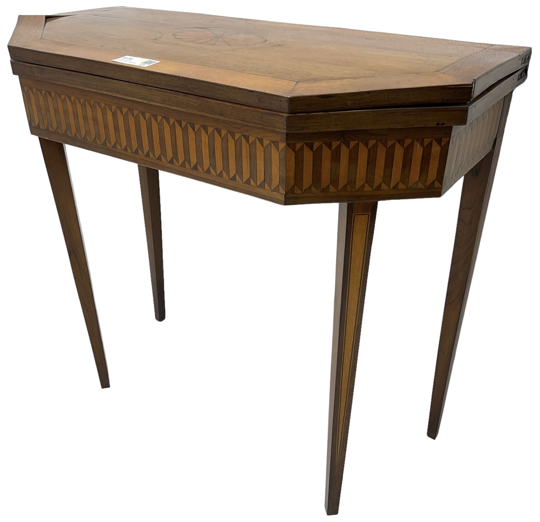 19th century inlaid mahogany card table, rectangular fold-over top with canted front corners, decorated with banded and strung edge with central inlaid fan motif, frieze decorated with geometric inlay, over a single action gate-leg base with square tapering supports