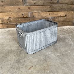 Set of three pressed metal planters in different sizes