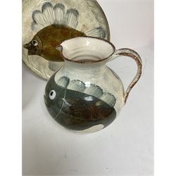 Collection of Yorkshire Moorlands Pottery, comprising two large circular dishes and three jugs, decorated with various fish, flowers, red grouse and cockerel
