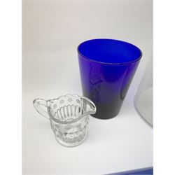 Two Victorian glass rolling pins, the larger blue example inscribed 'Remember Me' between floral sprays, largest L33.5cm, together with a late Victorian clear glass jug, H24cm, Bristol Blue type tumbler, and small moulded cream jug. 