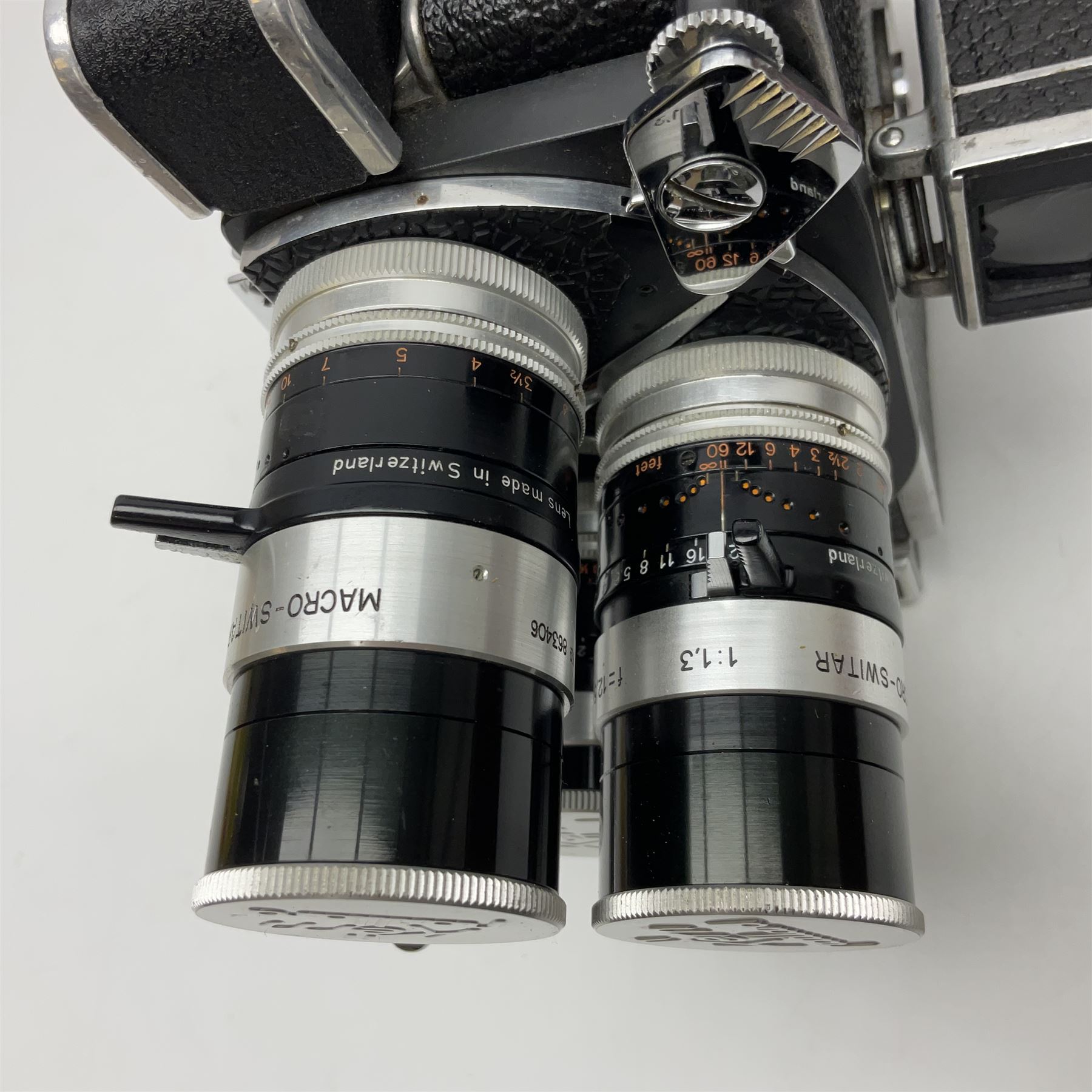 Paillard Bolex H8 RX4 cine camera body with turret for interchangeable lenses, serial no. 216071, with 'Macro Switar H8RX f1.4 36mm' lens, serial no.863406, 'Macro Switar H8RX f1.3 12.5mm' lens, serial no. 865770, 'Switar H8RX f1.6 5.5mm' lens, serial no. 937691 and RX fader, in fitted leather case