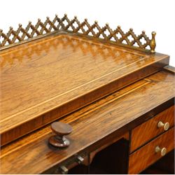 Regency period inlaid mahogany Ladies cylinder writing desk, the rectangular satinwood banded top with raised pierced brass three-quarter gallery, over a cylindrical roll-top enclosing a satinwood fitted interior with pigeonholes, correspondence drawers, ink wells and a sliding hinged writing slope, the base fitted with single frieze drawer, raised on square tapering supports
Provenance: Kirkham Hall