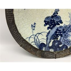 20th century Chinese blue and white crackle glaze charger, decorated with peonies, prunus blossom, and rockwork, within simulated bronze border, with character mark verso, D34cm