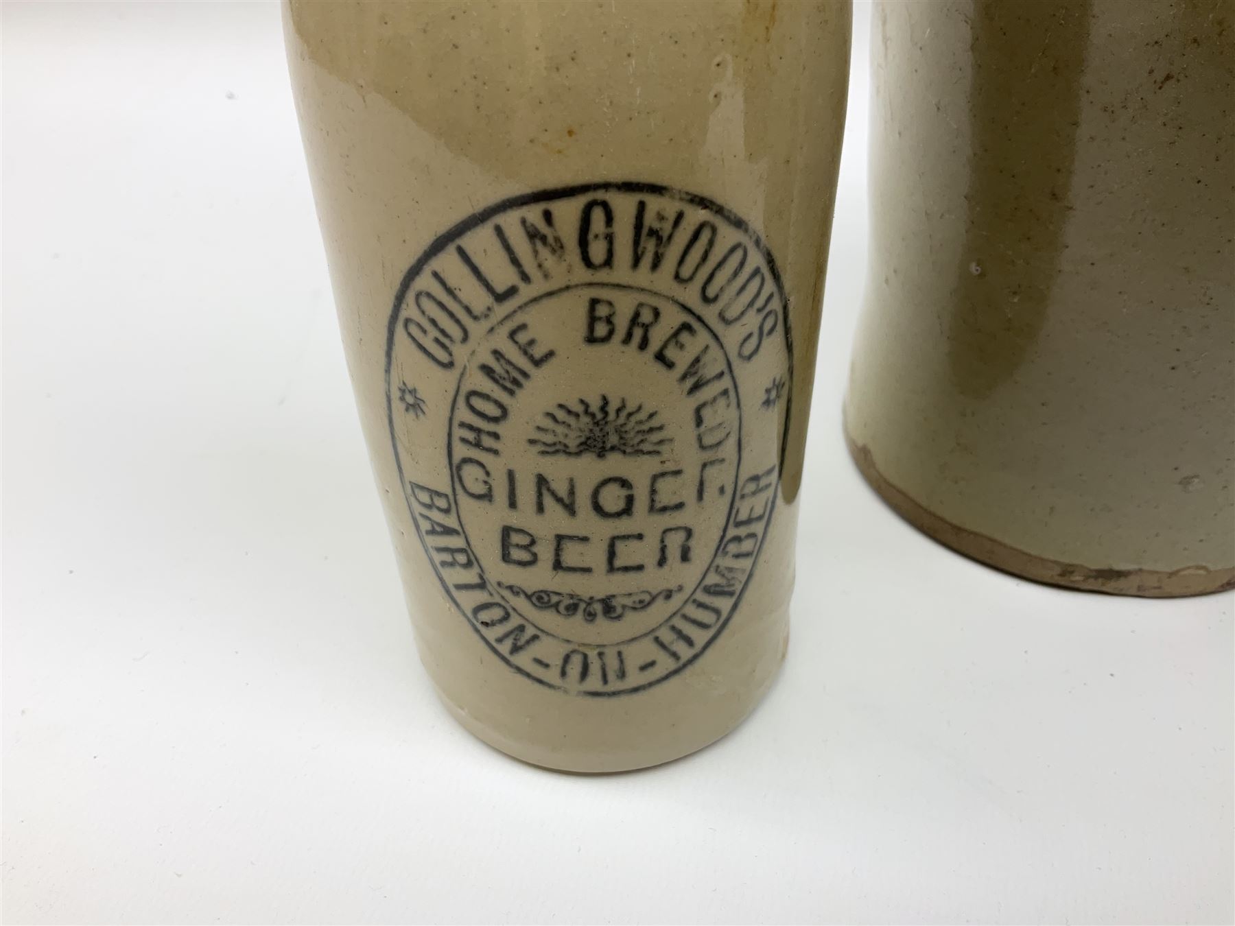 19th century stoneware gin bottle impressed I. Peck, Spirit Merchant Hull H27cm, Victorian salt glazed stoneware jar embossed W. Jefferson Mustard Manufacturer 47 Wincolmlee Hull, part cane covered stoneware flagon for John Smith Market Place Beverley and a Barton-on-Humber stoneware ginger beer bottle (4)  