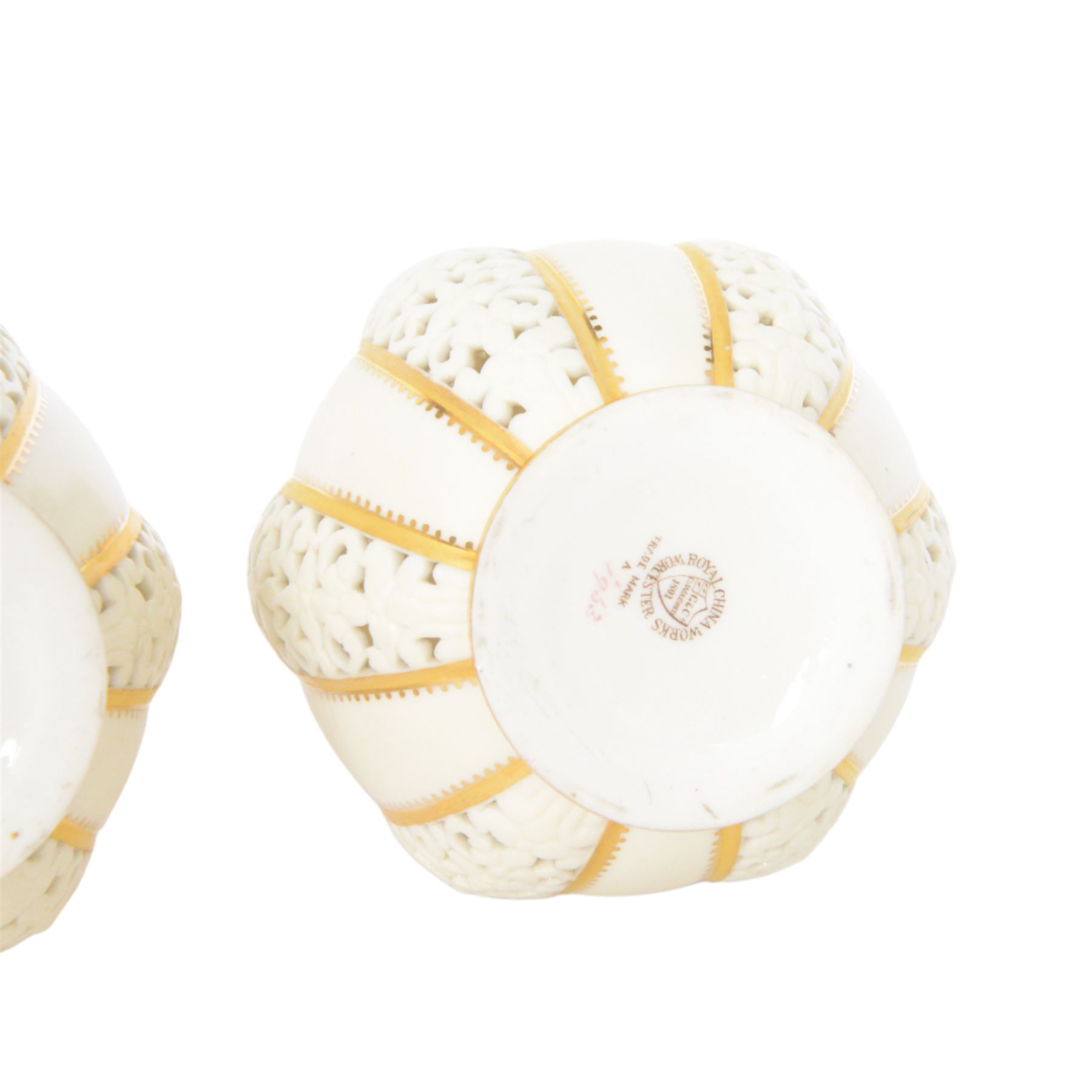 Pair of Grainger & Co. Royal China Works Worcester vases, of globular form with knopped elongated neck, with alternating reticulated panels  and gilt highlights, with printed mark beneath each numbered 1963, H19cm