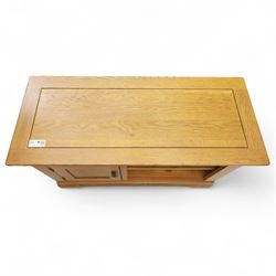 Oak Furnitureland - television and media cabinet, rectangular top with framed edge, fitted with single cupboard and open shelved section, on a stepped and shaped plinth