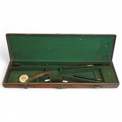 Brown leather shotgun case with cleaning rods and accessories
