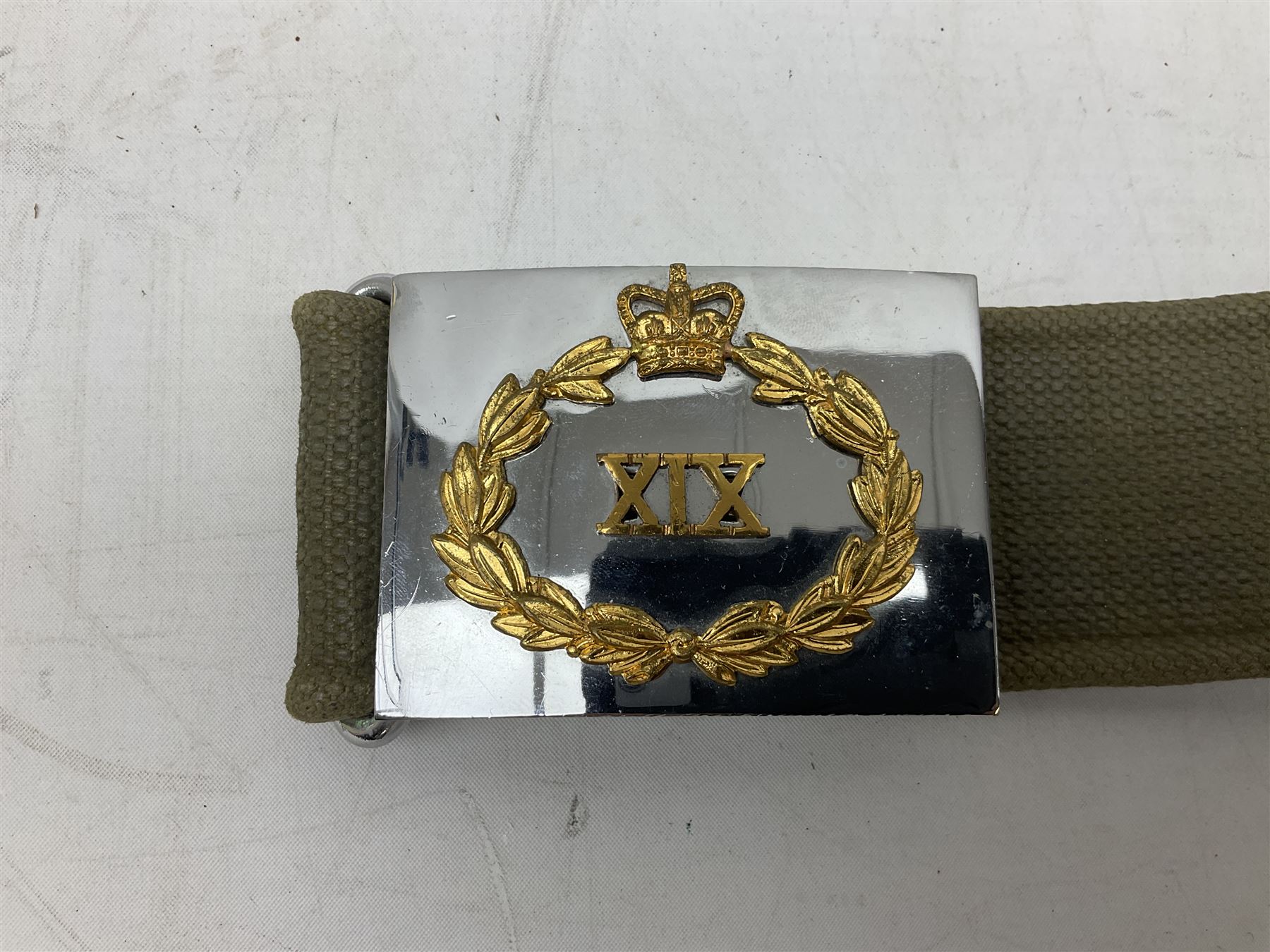 British Army Officers Sam Browne leather belt with shoulder strap; and webbing belt with Potter London Staybrite buckle for 19th Regiment of Foot (Green Howards) with various markings (2)