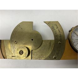 Late 19th/early 20th century boxwood and brass clinometer rule by Stanley, with inset magnetic compass, screw action protractor hinge divided to one degree with rise in inches per yard scale under, spirit level to one edge, marked 'W.F. Stanley Great Turnstile Holborn' with tables of distances, angles and thickness H16cm closed: in original leather covered case with instructions