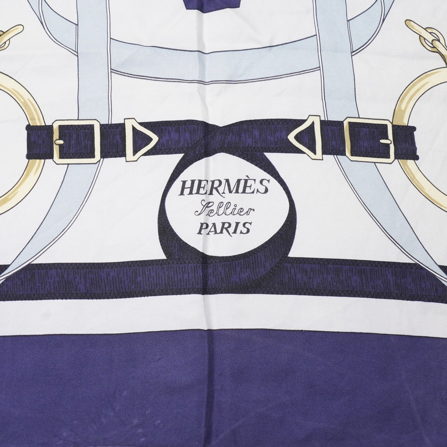 Hermès - ‘Éperon d’Or’ silk scarf, designed by Henri d’Origny, first issued 1974, navy, pale blue, ivory and gold colourway with hand-rolled edges