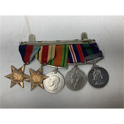 WWII group of five medals comprising 1939-1945 War Medal, Defence Medal, Africa Star, 1939-1945 Star and 1918-1962 General Service Medal with Malaya clasp awarded to Capt. J.E. Maskell R.A.O.C.; with ribbons on hanging bar; and matching group of miniatures, RAOC shoulder title, rank pips etc