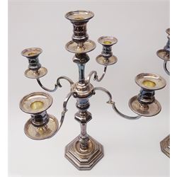 Pair of 20th century Mappin & Webb silver plated four branch candelabra, each with square stepped base with canted corners leading to knopped and faceted stem with central sconce, plain drip pan and removable nozzle, supporting four curved branches with conforming sconces, drip pans and nozzles, each impressed to base Mappin & Webb Ltd, H49.5cm