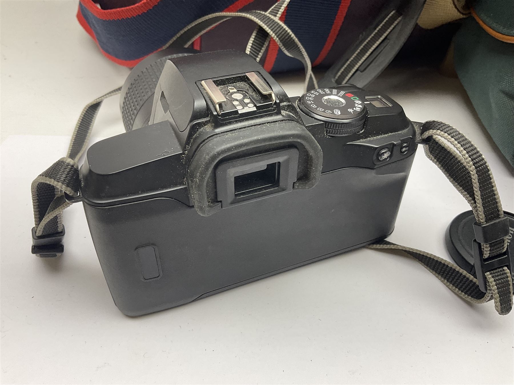 Cameras and accessories, to include Olympus OM101 Power Focus camera body, serial no 1076067, with 'Sigma AF Zoom 1:38, f=75 200mm' lens, serial no 2053714, Canon EOS 5000 camera body, serial no 1507812, with 'Canon Zoom EF 80-200mm, 1:4.5-5.6' lens, other cameras, by Miranda, Coronet and Ricoh and a collection of lenses, carry cases, etc 