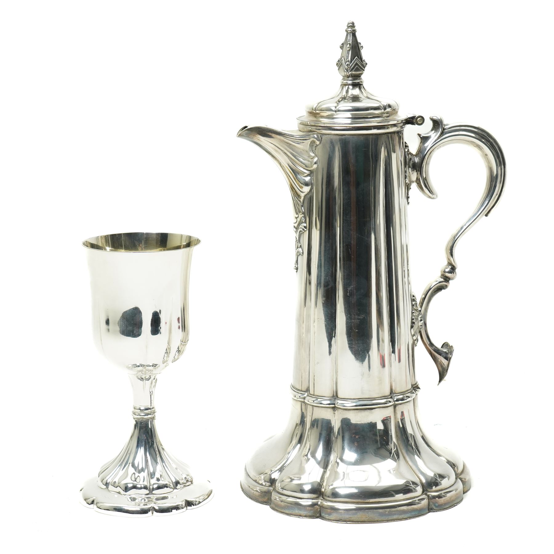 Large silver plated flagon probably by James Dixon with tapering lift, scroll handle and spreading lobed base H37cm, plated chalice with gilded interior by the same maker H21cm, plate chest with baize lined interior and countersunk handles W52cm and a pine stationery box