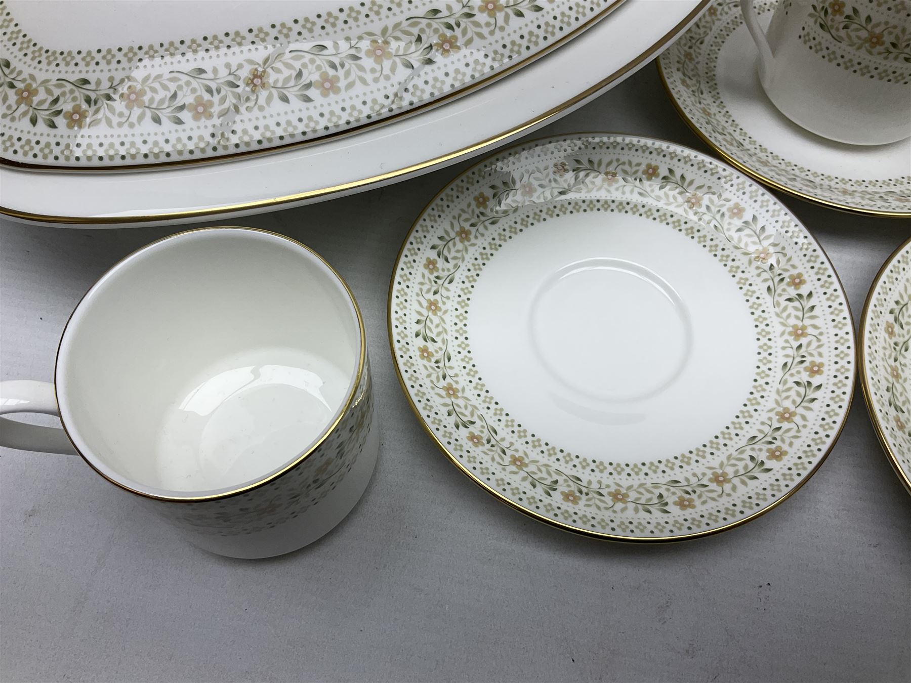 Royal Doulton Paisley pattern tea and dinner service for twelve, comprising dinner plates, side plates, soup bowls, dessert bowls, tea plates, two lidded tureens, sauce boat and saucer, sucrier and jug, oval serving dish and teacups and saucers