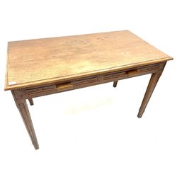 Early 20th century oak side table, moulded rectangular top over two drawers, square tapering supports with carved geometric detail