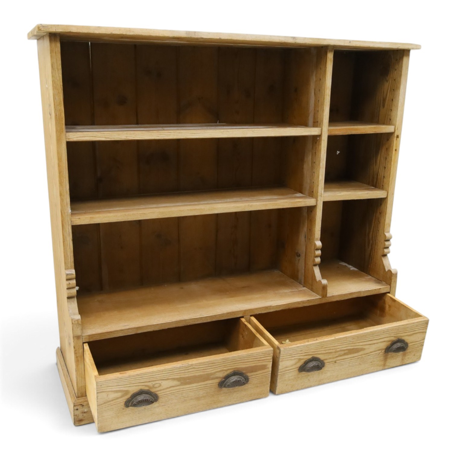 Late Victorian stripped pitch pine open bookcase, fitted with four adjustable open shelves, two drawers fitted to base with pull handles, on skirted base 
