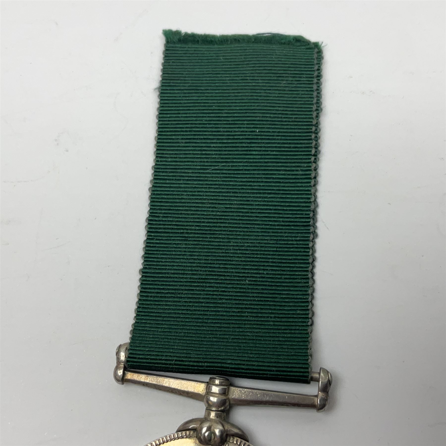 Victoria Long Service in the Volunteer Force Medal awarded to 369 Bombr. W. Woodward 1st Lincs. V.A.; and reproduction Victoria India Medal with Lucknow clasp; both with ribbons (2)