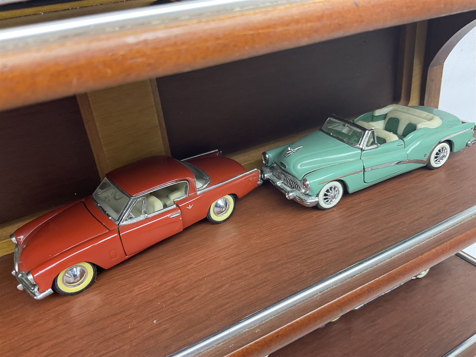 Franklin Mint 'The Classic Cars of the Fifties' collection with display rack, eleven (ex.12) die-cast models and folder of paperwork; another wall mounting display cabinet containing fifteen die-cast models; and an unused boxed Master Tools model display case