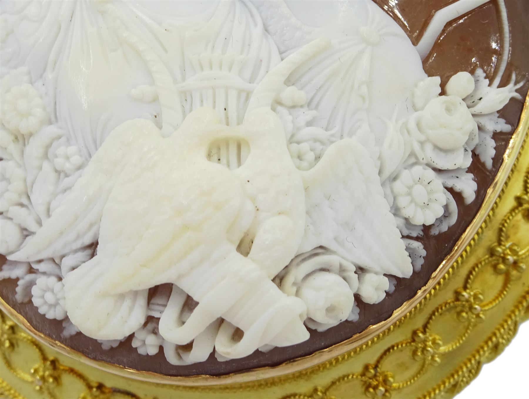 Victorian fine cameo brooch depicting Cupid and Psyche, in 18ct gold Etruscan Revival gold wirework mount, the reverse indistinctly signed Lamary, in original fitted silk and velvet lined case