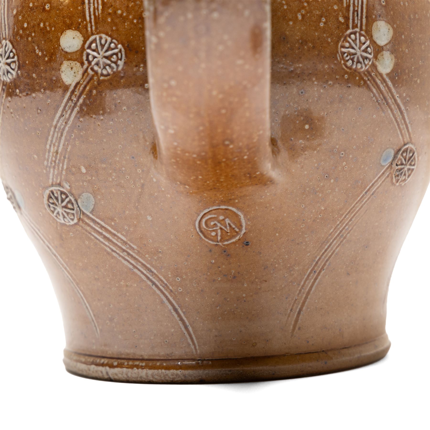 Gus Mableson - two studio pottery teapots, the larger example with a repeating floral pattern upon a brown ground, each with impressed makers marks below the handle, largest H18cm