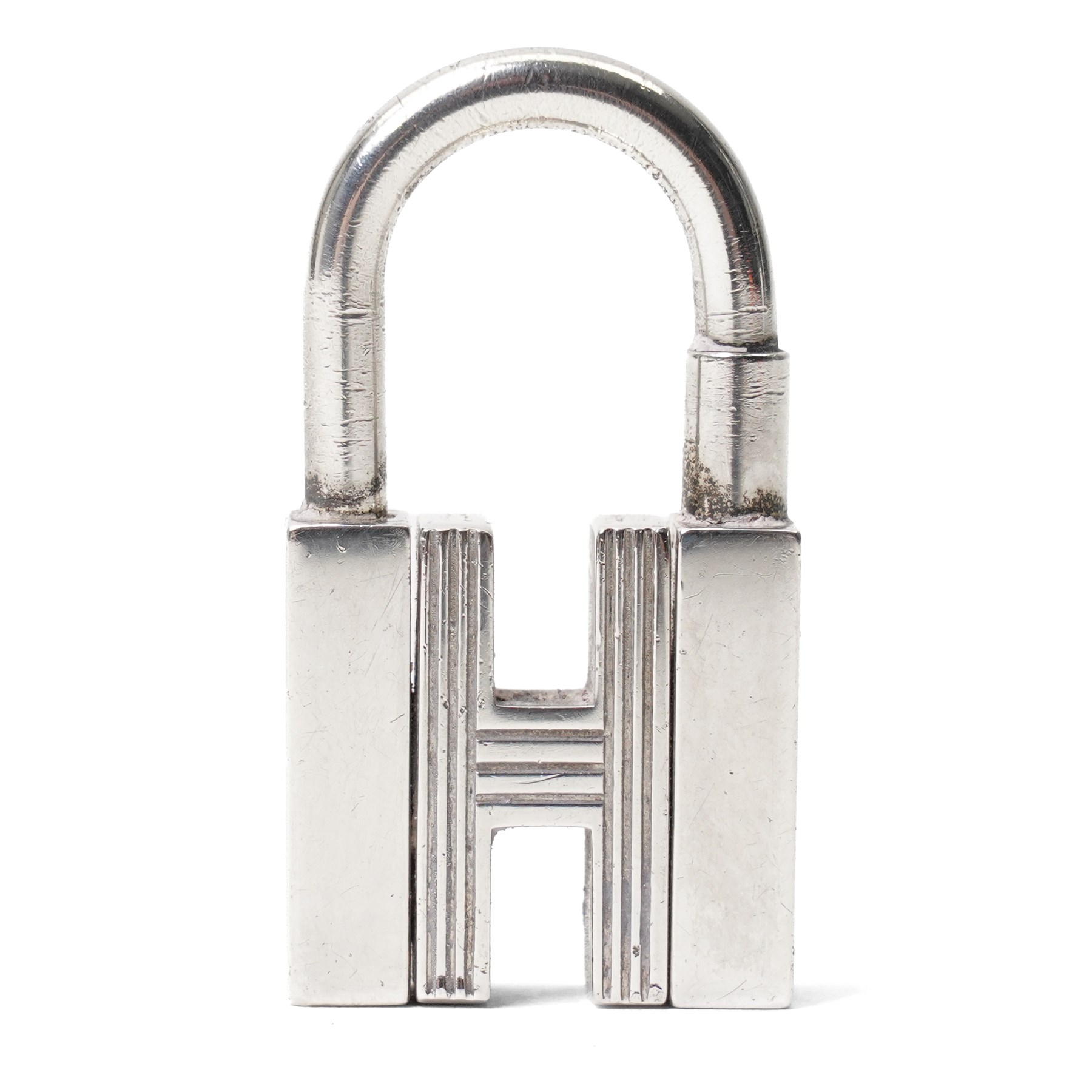 Hermès - sterling silver Cadena H padlock charm, modelled as the letter H with hinged shackle, stamped Hermès and with French silver assay mark, with original  box