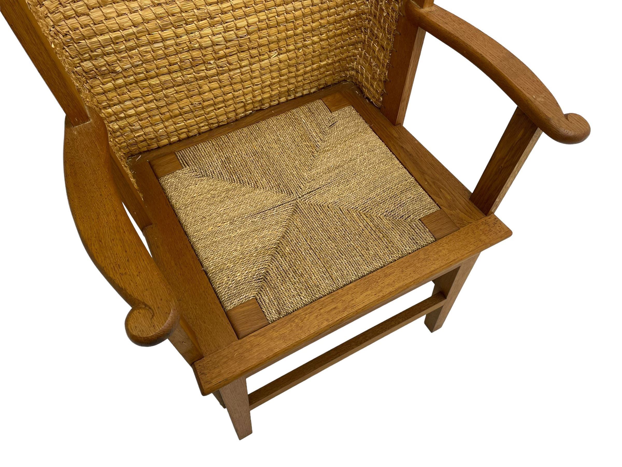 Reynold Eunson (1932–1978) for David Munro Kirkness, Kirkwall, Orkney - oak framed Orkney chair, woven straw canopy back, drop-in rush seat, the arm terminals carved with scrolls, on square tapering supports joined by plain stretchers, the front rail inscribed with makers marks