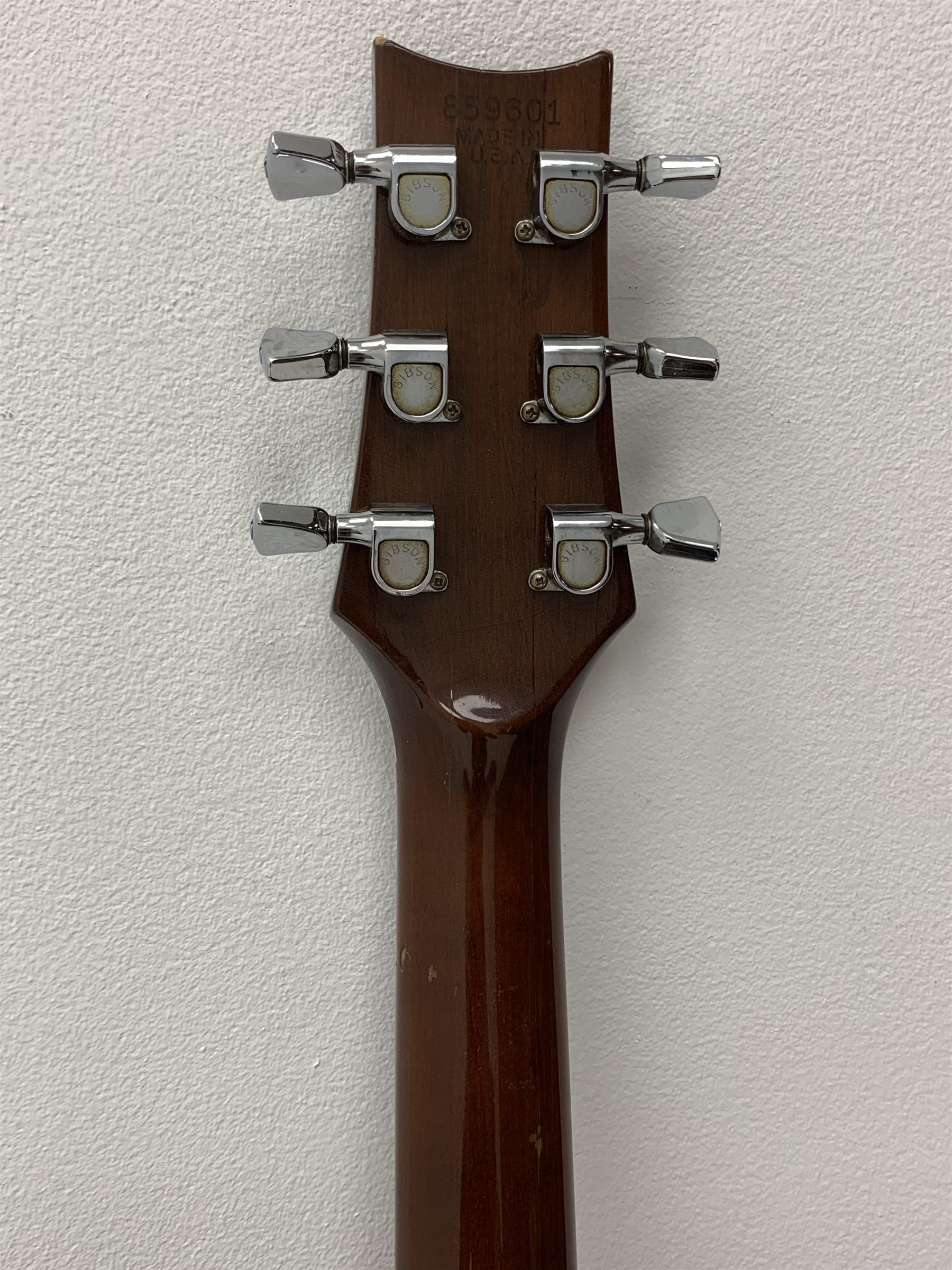 Rare Gibson Mk 35 acoustic guitar with mahogany back and sides, rosewood fingerboard, spruce top, fan-patterned bracing, nickel plated hardware and dot inlays, serial number 859651 in carrying case 
