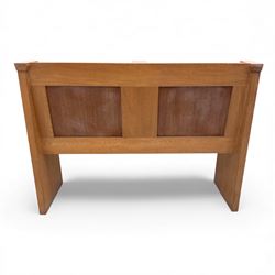 Pair of mid 20th century oak ecclesiastical pews, each with panelled backrests and shaped end supports, of solid construction and mellow honeyed tone