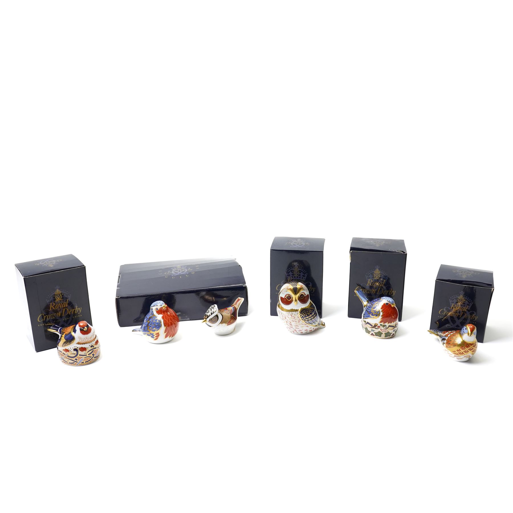 Six Royal Crown Derby paperweights, comprising Robin (unboxed), Robin nesting with gold stopper, Goldfinch nesting with gold stopper, Linnet with gold stopper, Tawny Owl with gold stopper and Crested Tit with gold stopper (6)